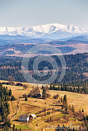 Snow caped mountains in sunny spring day. Stock Photo