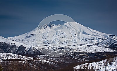 Snow capped mountain peak Stock Photo