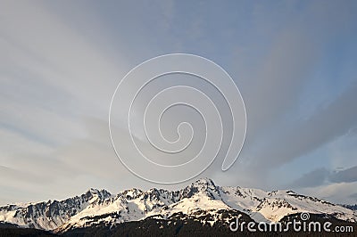 Snow capped mountain range Stock Photo