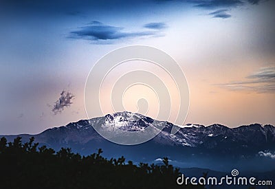 Snow Capped Mountain at Sunset or Sunrise - Pikes Peak Stock Photo