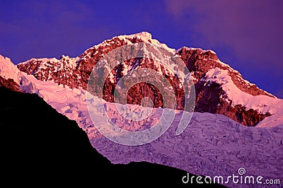 Snow-capped mountains at dusk Stock Photo