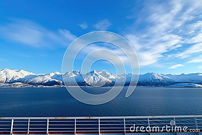 snow-capped mountains under clear polar sky from cruise deck Stock Photo