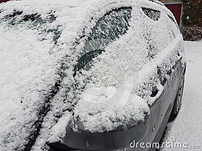 Snow on the car in his front yard in Storkow Stock Photo