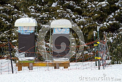 Snow covered beehives Stock Photo