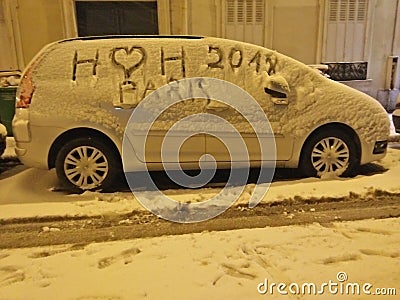 Snow covered car in Paris - Beautiful snow Paris - i love snow Stock Photo