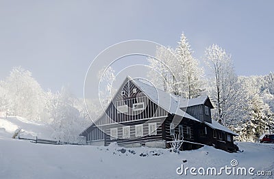 Snow covered chalet Stock Photo
