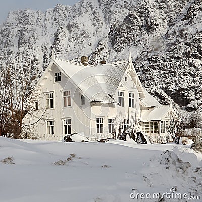 Snow-covered house in the mountains Stock Photo