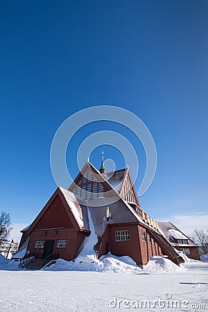 Snow covered Kiruna Church in the shape of a Sami goahti in Kiruna, Sweden Stock Photo