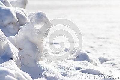 Snow covered landscape in cold winter with frosty and frozen snowbanks show the icy side of winter in January and February as tour Stock Photo