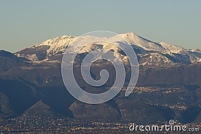 Snow-covered Matese Mountains seen from Castel Morrone after the sharp drop in temperatures that affected the whole of Italy. Stock Photo