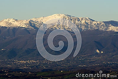 Snow-covered Matese Mountains seen from Castel Morrone after the sharp drop in temperatures that affected the whole of Italy. Stock Photo