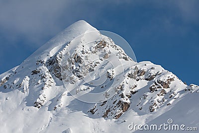 Snow covered mountain peak Stock Photo