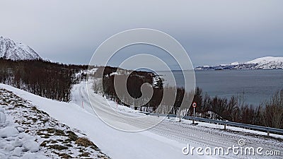 Road to the Lofoten on Hinnoya near Myrland in winter in Norway Stock Photo