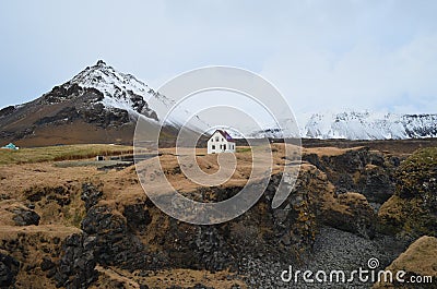 Snow Covered Mountains Surround Hellnar Iceland Stock Photo