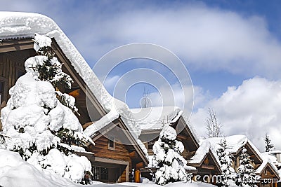 Snow covered rooftops of mountain cabins in Whistler. Stock Photo