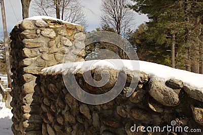 snow covered stone wall, entrance to Dean Park Shrewsbury, Ma Stock Photo