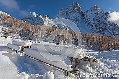 Snow-covered tables facing awesome Mount Pelmo winter panorama Stock Photo