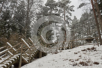 Snow-covered tourist stairs woods Stock Photo