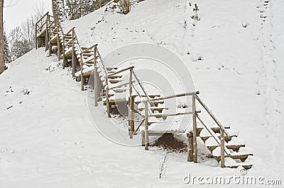 Snow-covered tourist stairs woods Stock Photo