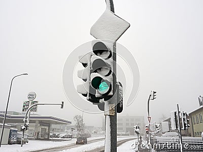 Snow-covered traffic light and shipping sign. Winter attack in Germany. Snowstorm in NRW in the Mettmann district Editorial Stock Photo