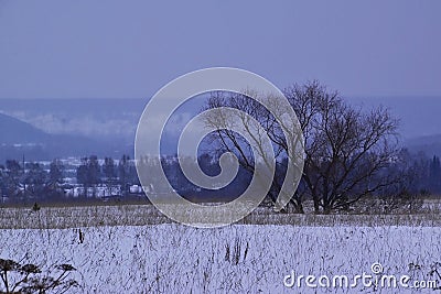 Snow-covered Ural expanses in the valley of the Sylva River against the backdrop of Mount Podkamennaya Stock Photo