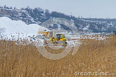 Snow-covered winter clay quarry Stock Photo