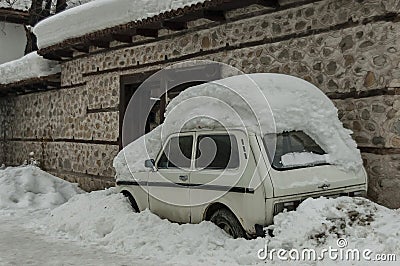 Snow-drift cover front door and car in winter at Bansko Editorial Stock Photo