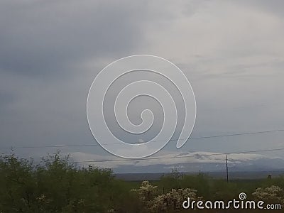 Snow Faked Clouded Mountains Stock Photo