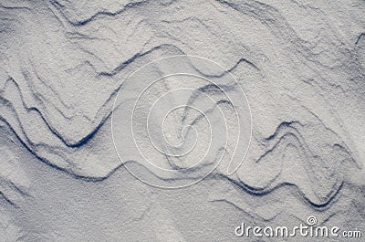 Snow fields covered with intricate patterns from the wind, a copy space, close-up. Stock Photo