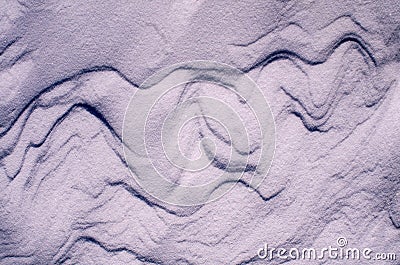 Snow fields covered with intricate patterns from the wind, a copy space, close-up, toned. Stock Photo