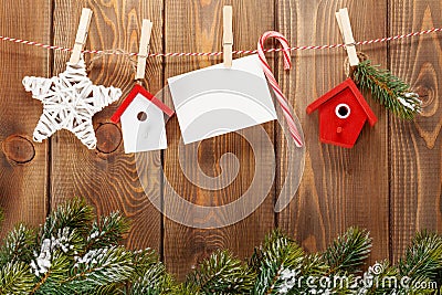 Snow fir tree, photo frame and christmas decor on rope Stock Photo