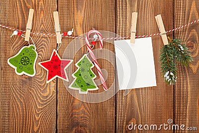 Snow fir tree, photo frame and christmas decor on rope Stock Photo