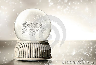 Snow globe against silver Stock Photo