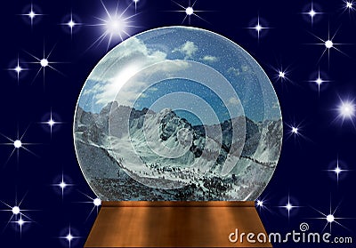 Snow globe with snow-covered mountain tops Stock Photo