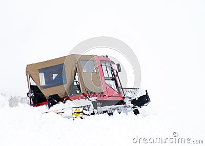 Ratrack - snow groomer - advancing in deep snow Stock Photo