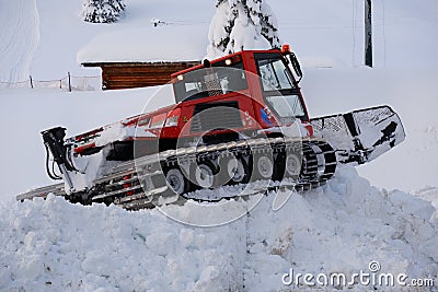 Snow groomers bulldozer tracks on the snow Editorial Stock Photo