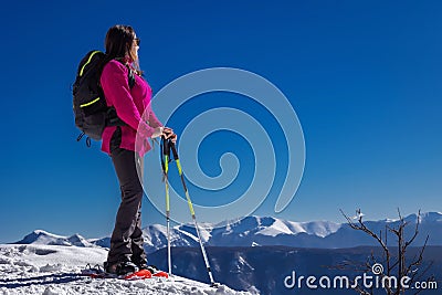 Snow hiker in the mountains, middle aged woman Stock Photo