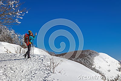 Snow hiker in the mountains, middle aged woman Stock Photo