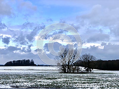 Snow lies on farmland in England Stock Photo