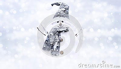Snow man on blurred bright christmas lights background, greeting Stock Photo