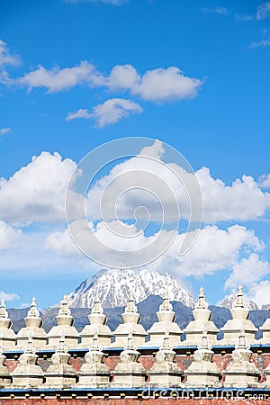 Snow Mountain and stupas Stock Photo