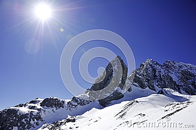 Snow mountain with sunny sky Stock Photo