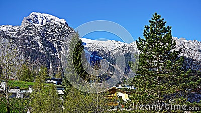 Snow on the mountain tops in the Alps Stock Photo