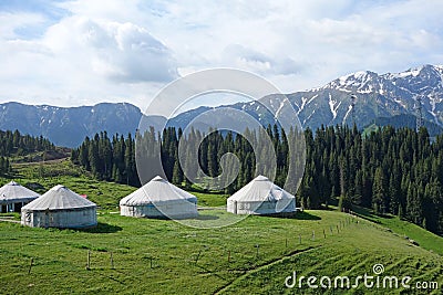 Snow mountains with yurts Stock Photo