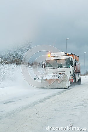 Snow plough clearing heavy snowfall Stock Photo