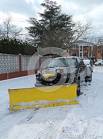 Snow plow truck in Brooklyn, NY ready to clean streets after massive Winter Storm Helen strikes Northeast Editorial Stock Photo