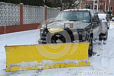 Snow plow truck in Brooklyn, NY ready to clean streets after massive Winter Storm Helen strikes Northeast Editorial Stock Photo