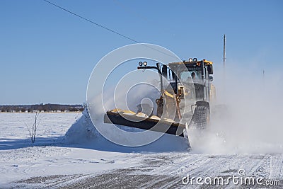 Snow plower on rural road Editorial Stock Photo