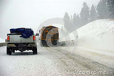 Snow plows keep the road open Stock Photo