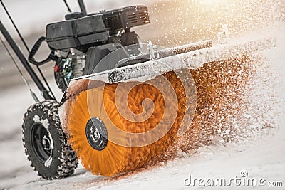 Snow Removal with Brush Broom in Action Stock Photo